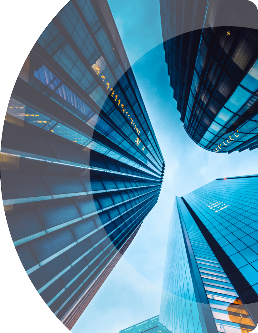 A circular image showcasing tall buildings against a blue sky.
