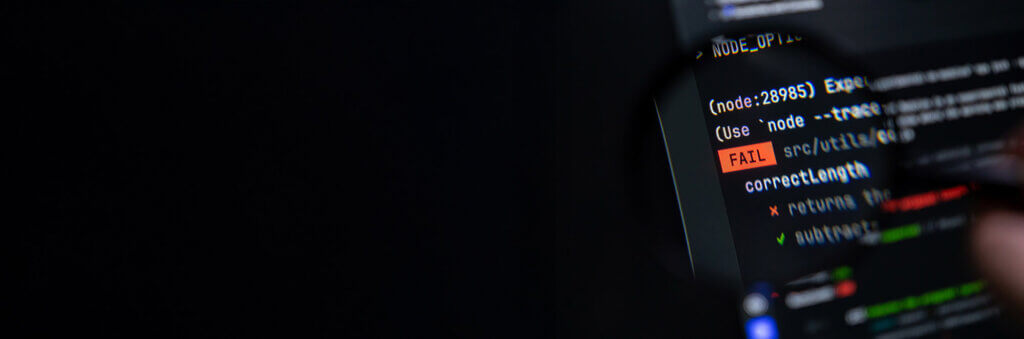 Close-up of a dark terminal screen displaying a bright orange FAIL banner within lines of coding, representing a critical software build issue or significant system malfunction